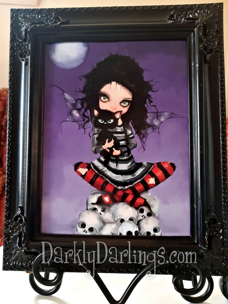 Goth girl with her black cat and skulls in a gothic frame
