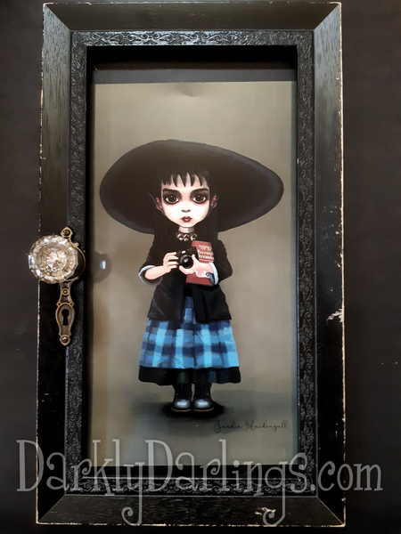 Lydia Deetz from Beetlejuice in a gothic frame