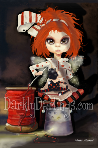 Red haired fairy on a thimble sewing her doll