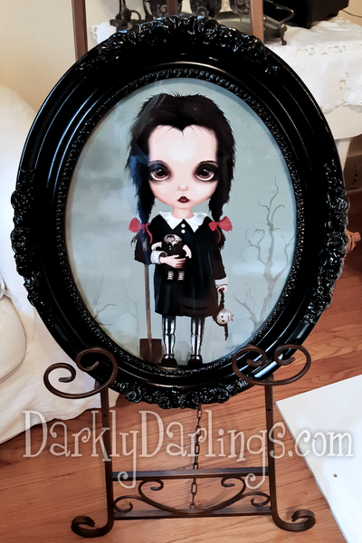 Addams Family fan art of Wednesday Addams portrayed by Christina Ricci in a gothic frame 